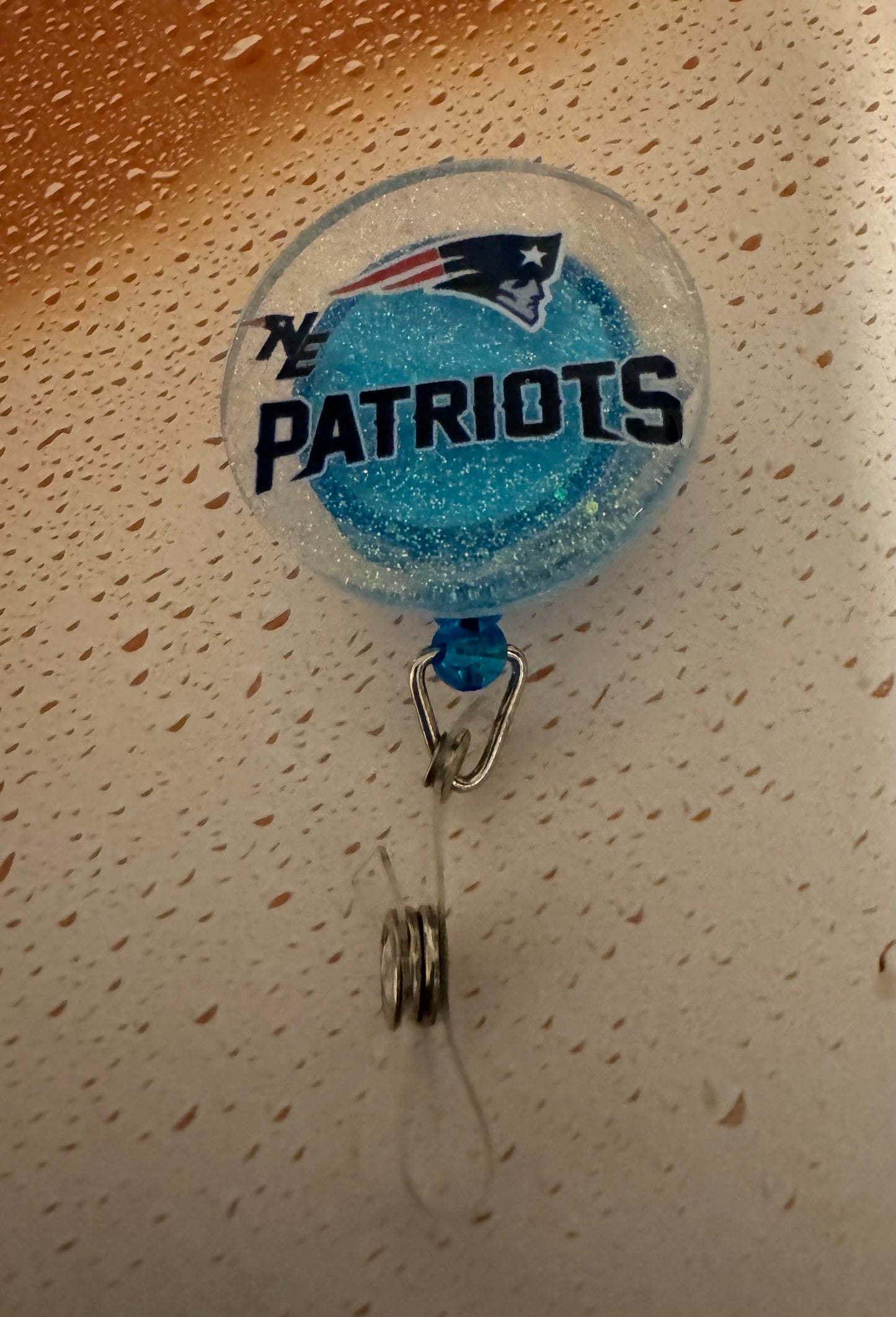Clear With Blue Patriots Badge Reel