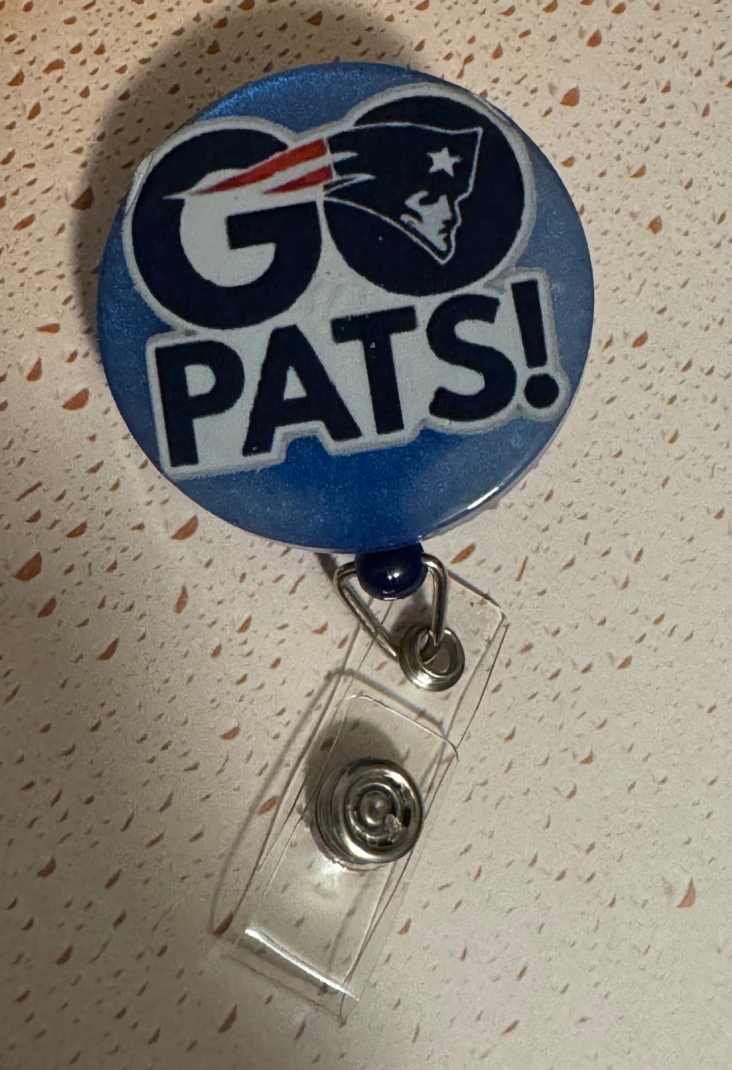 Go Pats Blue Badge Reel